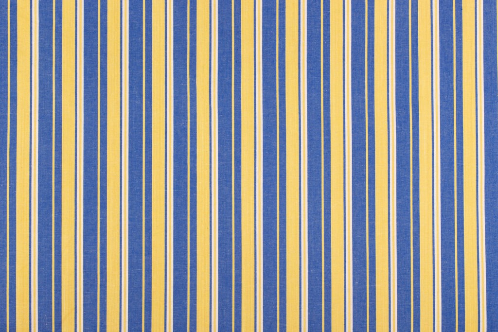 Tejido artesanal modelo 228 azul, amarillo y oro de Teixits Vicens